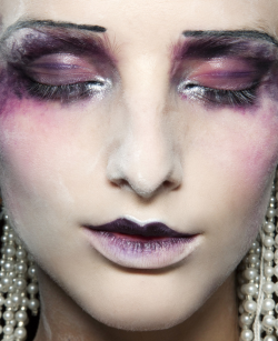 garconniere:  i believe this is makeup artist pat mcgrath for john galliano. 