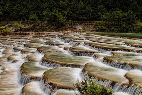 by `James Wheeler on Flickr. Step Falls scenic point at the Yulong snow mountain park in Yunnan, Chi