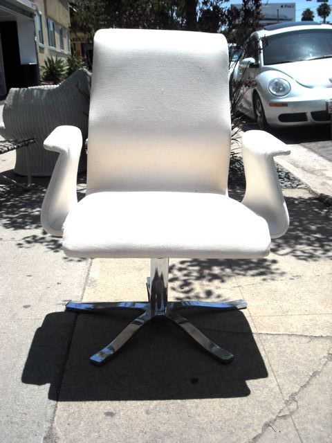 White midcentury swivel chair. High back. Chrome base.
$325