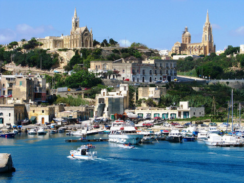 by StewieD on Flickr.Churches in Mġarr Harbour, Gozo island, Malta.