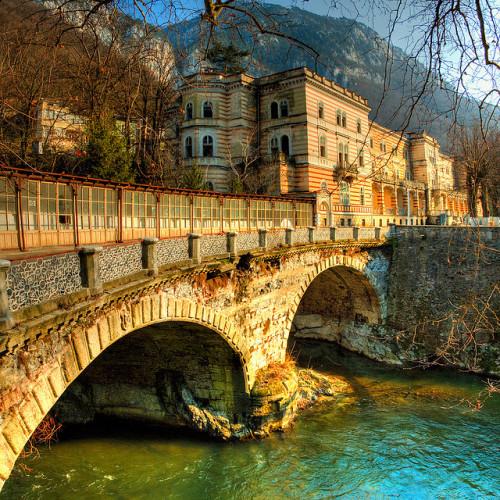 by cotropitor on Flickr.Bridge crossing Cerna river in Baile Herculane thermal spa resort, Romania.