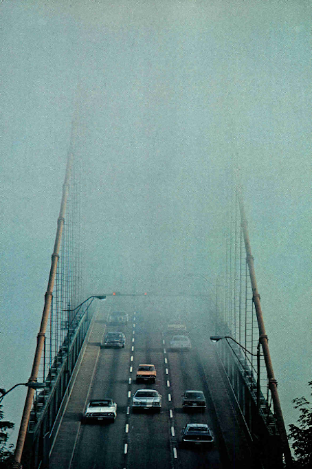Fog, the magician, erases half of Lions Gate Bridge. The pervasive mist shrouds the city 62 days a y