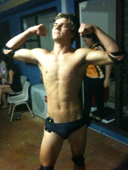 Flexing frat boy, in a speedo.