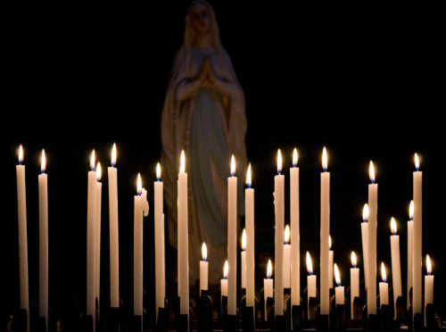 Candles in the church of San Luigi dei Francesci.