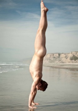 Naked handstand on the beach.  [#gayporn