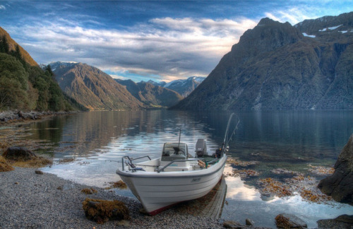 by macerlend on Flickr.Boat on the shores of Hjørundfjorden, a fjord in Møre og Romsdal county, Norw