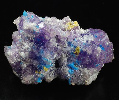 dewdropzgarden:  lilac coquimbite, yellow traces of copiapite and blue electric spots