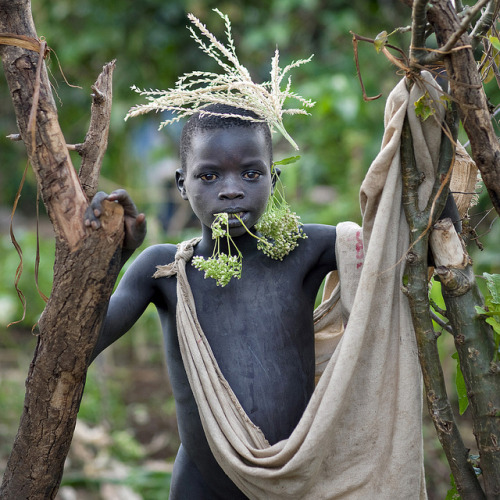 ectoplasmosis:Surma kid - Omo valley Ethiopia by Eric Lafforgue on Flickr.The photographer says:Body