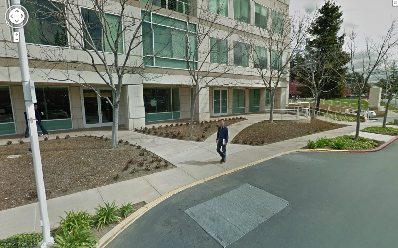 dream beam: Guy carrying Macbook outside of the Apple Campus