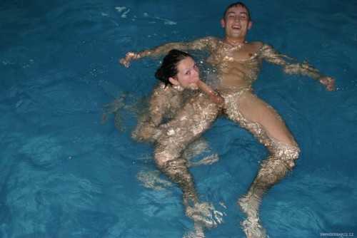 nudistlifestyle: Nudist couple having some fun in the pool ! Lucky Guy !