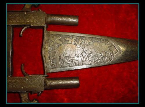 firearmshots:Indo-Persian Katar punch dagger with twin mounted .50 caliber black powder muskets. Fin