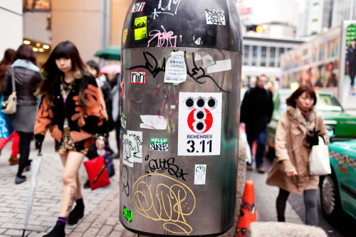 Large &ldquo;Remember 3.11&rdquo; street art sticker in Shibuya.