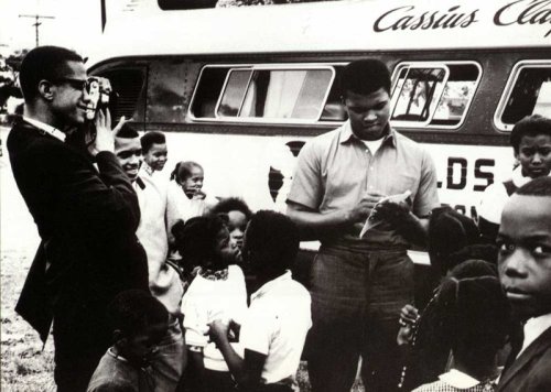 theconcretearchives:  A rare shot of Malcolm X photographing Cassius Clay prior to his conversion to Islam. 