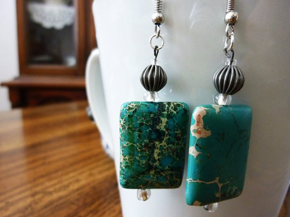 Turquoise Slab and Metal Earrings Turquoise clay, glass beads, and metal earrings, fairly light, 1.6 inches long.
As many of my pieces are made of handmade components, each piece is unique and crafted with care.
All earrings can be made as...