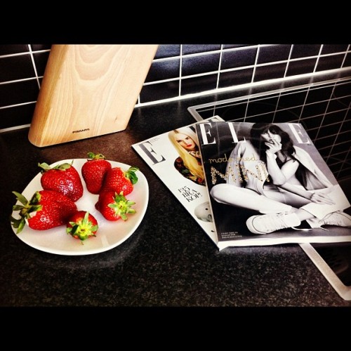 A fashionista&rsquo;s breakfast! #ellemagazine and #strawberries. #fashion (Taken with instagram)