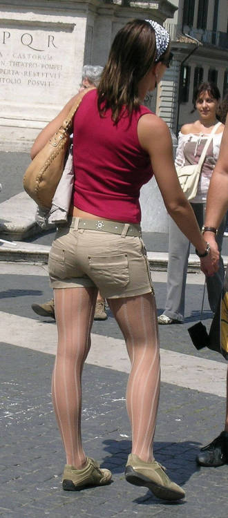 Street candid of a woman wearing short over fashion #pantyhose.