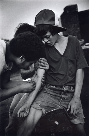  An 11 year-old boy tries heroin on rooftop. The Bronx, New York. 1977. 