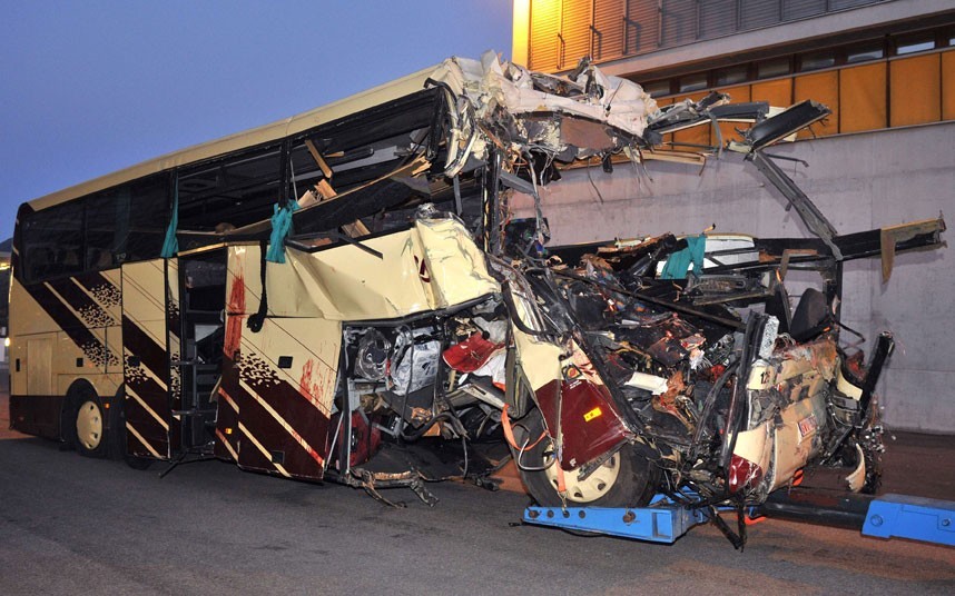 Sierre, Switzerland
The wreckage of a bus after it crashed inside a motorway tunnel. Twenty-eight people, including 22 children returning from a skiing holiday, died in a bus accident. (via Telegraph)