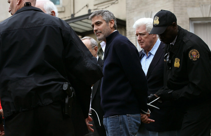 simply-war:  The actor George Clooney was among more than a dozen protesters arrested