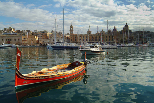 A Maltese dghajsa in the Birgu Marina Waterfront, Cottonera, Malta (by whl.travel).