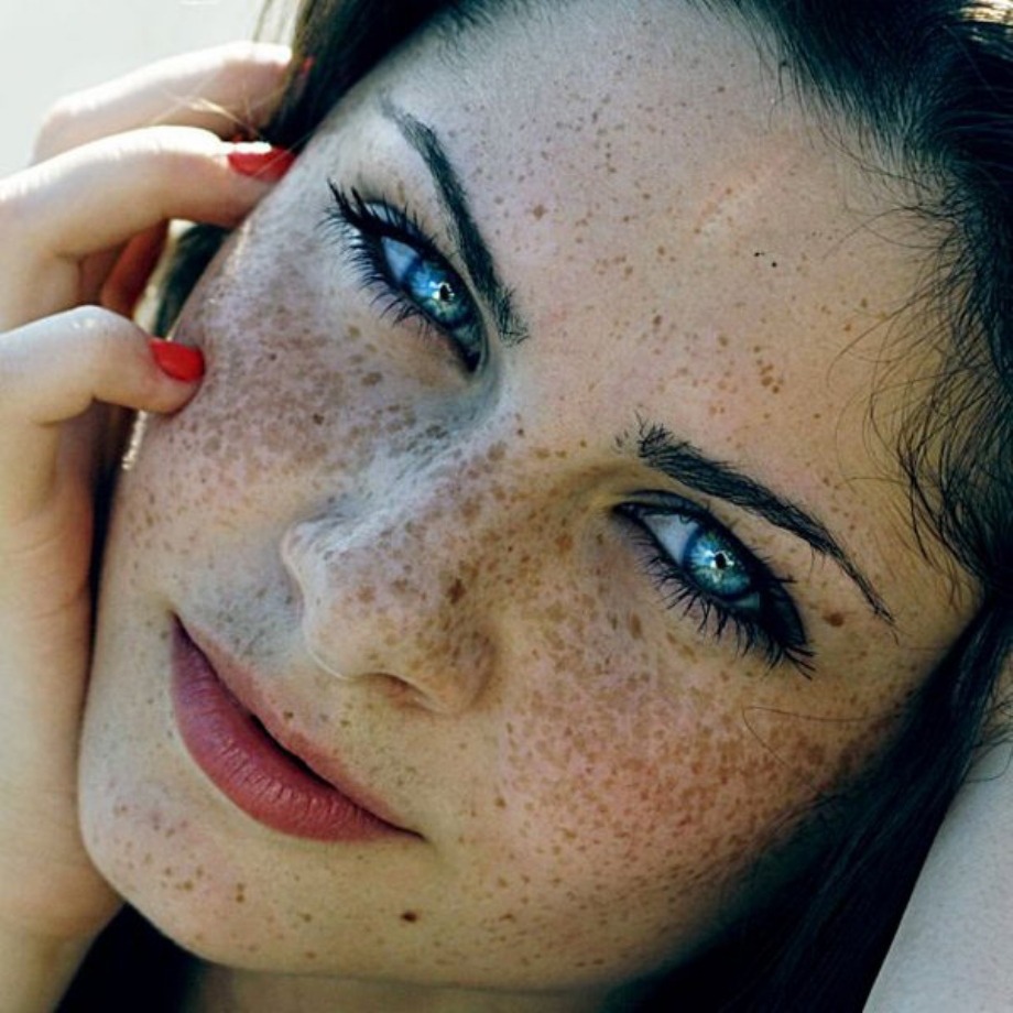 Girl with red hair freckles green eyes