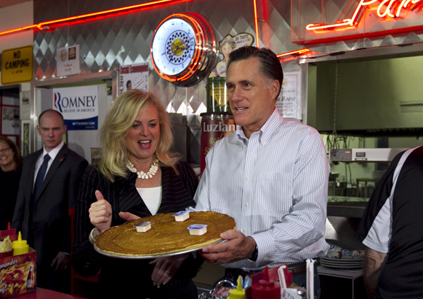 The road to the White House apparently leads through a giant pancake: Mitt and Ann Romney, campaigning at Charlie Parker’s Diner in Springfield, Illinois. (Photo by Steven Senne/AP)