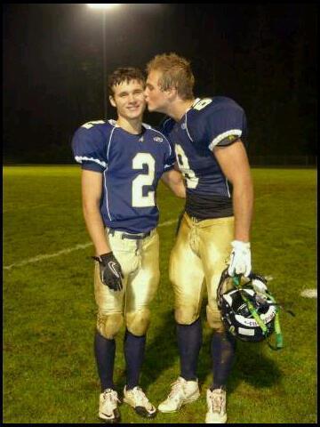 Football teammate giving his frat bro a kiss.