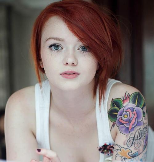 jamesv2:  Little tattooed redhead that has the look of emma stone about her. *update.