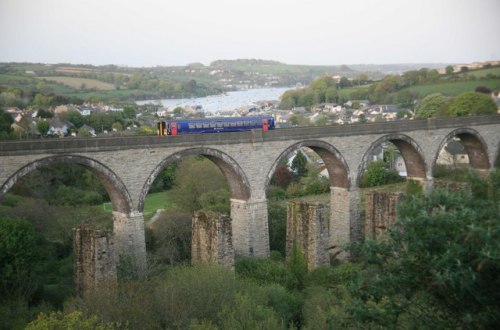 Falmouth to Truro train on the College Wood viaduct, Penryn, Cornwall.  The remains of the prev