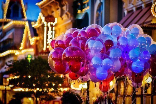 naughtylilcupcake:  The happiest place on earth… …and I want to be there, ears on, carrying a bushel of these balloons, and eating cotton candy…the fluffy pink kind…   Thirty minutes from me. Wanna go? ;-)