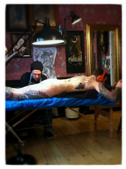  Adam gets his ass tattooed  :-) 