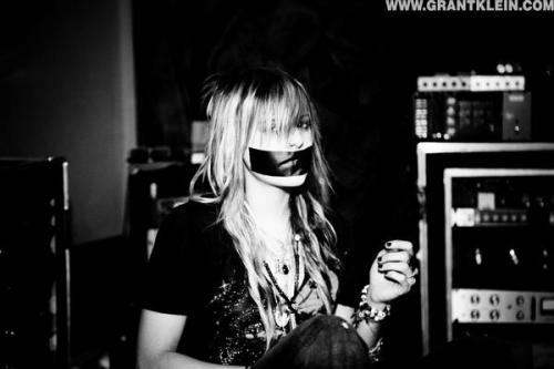 Lead singer of Automatic Loveletter has her mouth taped shut in the studio.