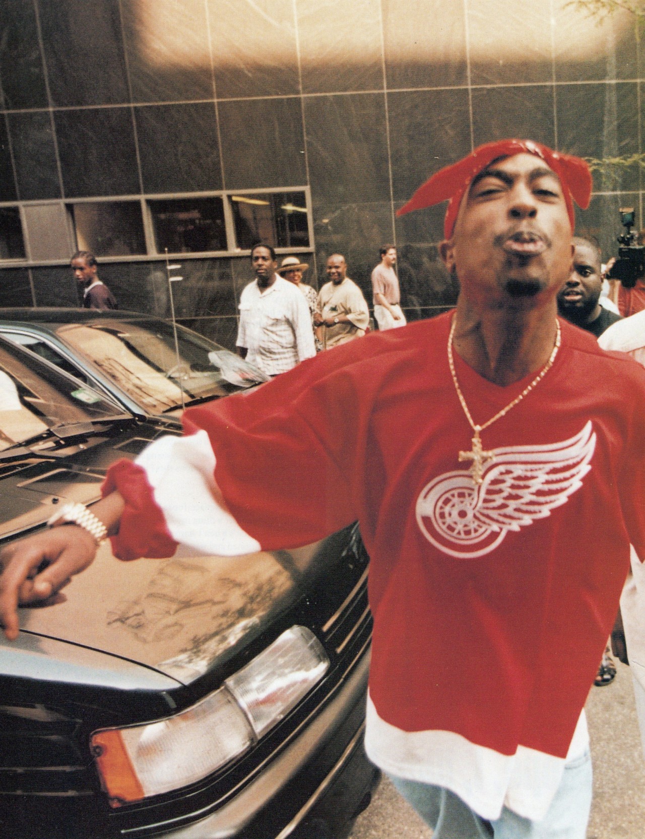 TUPAC Shakur in his Detroit Red Wings jersey, spitting at the
