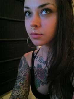 thebattleshark:  Tattoos and septum piercings.