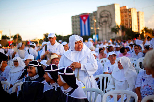 Nuns wait as worshippers gather in Revolution Square for the arrival of Pope Benedict XVI in Havana,
