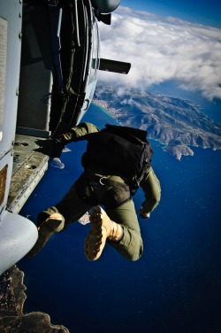 devochkaa-deactivated20140530:   A Sailor assigned to Naval Special Warfare, U.S. Special Boat Team, jumps out of the MH-60S Sea Hawk helicopter “Ghostrider 53”, assigned to Helicopter Sea Combat Squadron (HSC) 28, Det. 1, as it flies over Megara