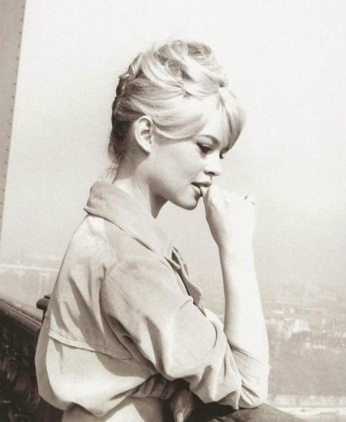  Brigitte Bardot at the top of the Eiffel Tower, Paris, 1950s. 