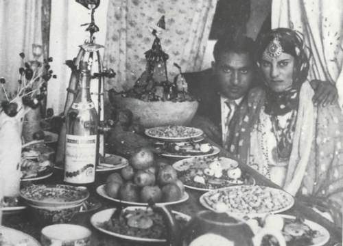 Jewish couple at the khanch-e hana (henna table) for their henna ceremony, Herat (Afghanistan), mid-