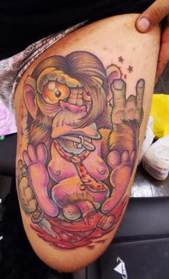 fuckyeahtattoos:  Picture taken at the first tattoo convention in Ribeirão Preto, Brazil.New School made by the artist Marcelo Marzari from Curitiba, Brazil.Monkey emo cutting the penis, a satire behind the art.Leonardo Martins, tattooist in