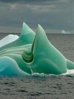 luckyspikes:  letslook4treasure:  Striped Icebergs Icebergs sometimes have stripes, formed by layers of ice deposited on different conditions. Blue stripes are created when a crevice in the ice sheet fills up with melted water and freezes so quickly that