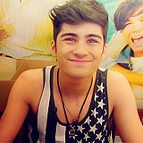 :  9 Photos of Zayn Malik: ↳ Wearing Tank