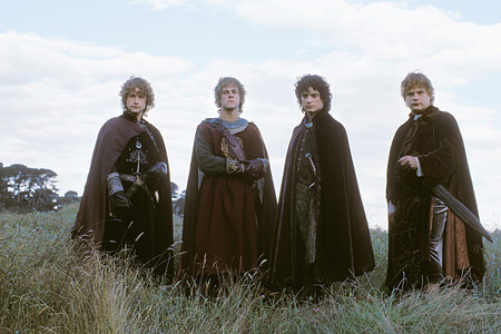 ninnyhammers:rare promo shot of all four hobbits in their regal finery.  LotR - RotK.