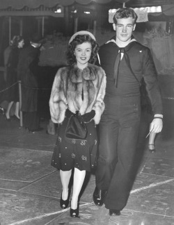 miss-shirley-temple:  Shirley Temple and Guy Madison arrive at the premiere of ‘Since You Went Away’, 1944. Note: She’s wearing a skirt here that is patterned with her initials. I’m still not sure whether this is a custom piece or part of a retail/high