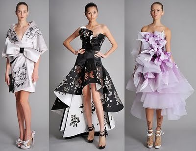 these dresses are fascinating. they kinda remind me of how paper is like when it is folded. and i definitely like the flower details on the kimono type dress and the black and white dress.