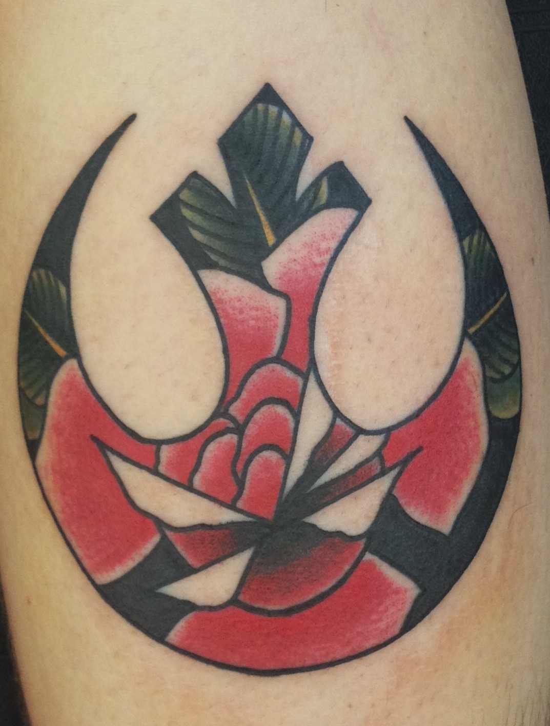 Hello, My name is Drew Cottom and i work at Amillion Tattoo in Austin, tx. This tattoo was so much fun to do. Its a traditional rose inside The Rebel Alliance logo. If you would like to get tattooed you can find me on Facebook.com/drewcanada or...