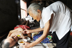  A Mother (97 Years Old) In China, Feeding And Taking Care Of Her Paralysed Son (60
