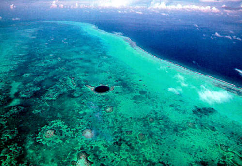 The Great Blue Hole.     This giant submarine sinkhole is over 300 metres wide and 124 metres deep. 