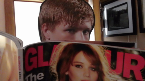 3peetasarebetterthan1: Peeta looks at all the sexy Capitol pictures of Katniss in Glamour magazine.