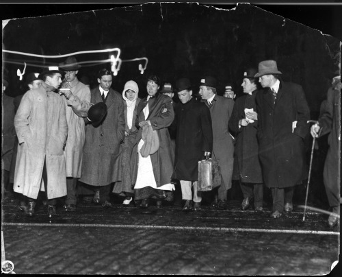 April 18, 1912. Members of the press interview Titanic survivors coming off the rescue ship, The Car