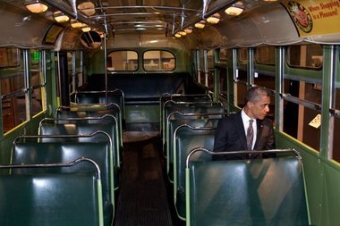 …Barack Obama in Rosa Parks’ famous seat
